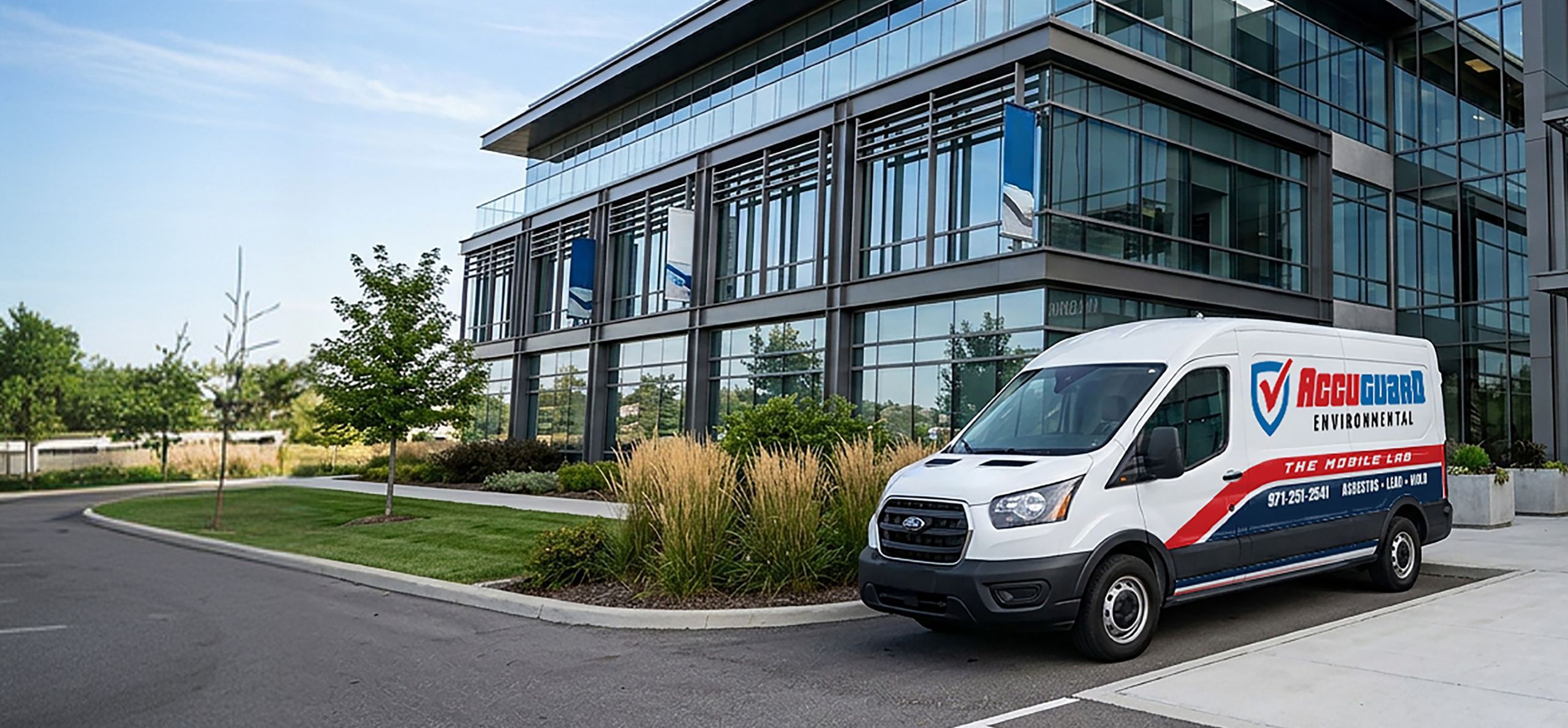 An AccuGuard Environmental van parked outside of a corporate building